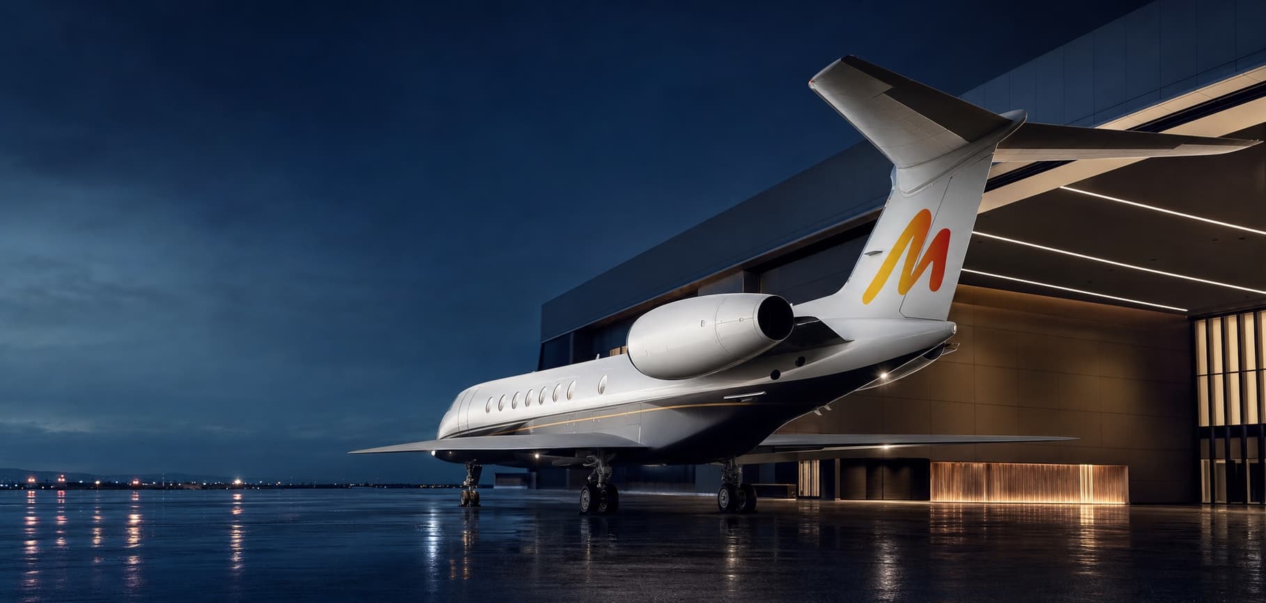 MetaJetz campaign aircraft outside a private terminal at blue hour