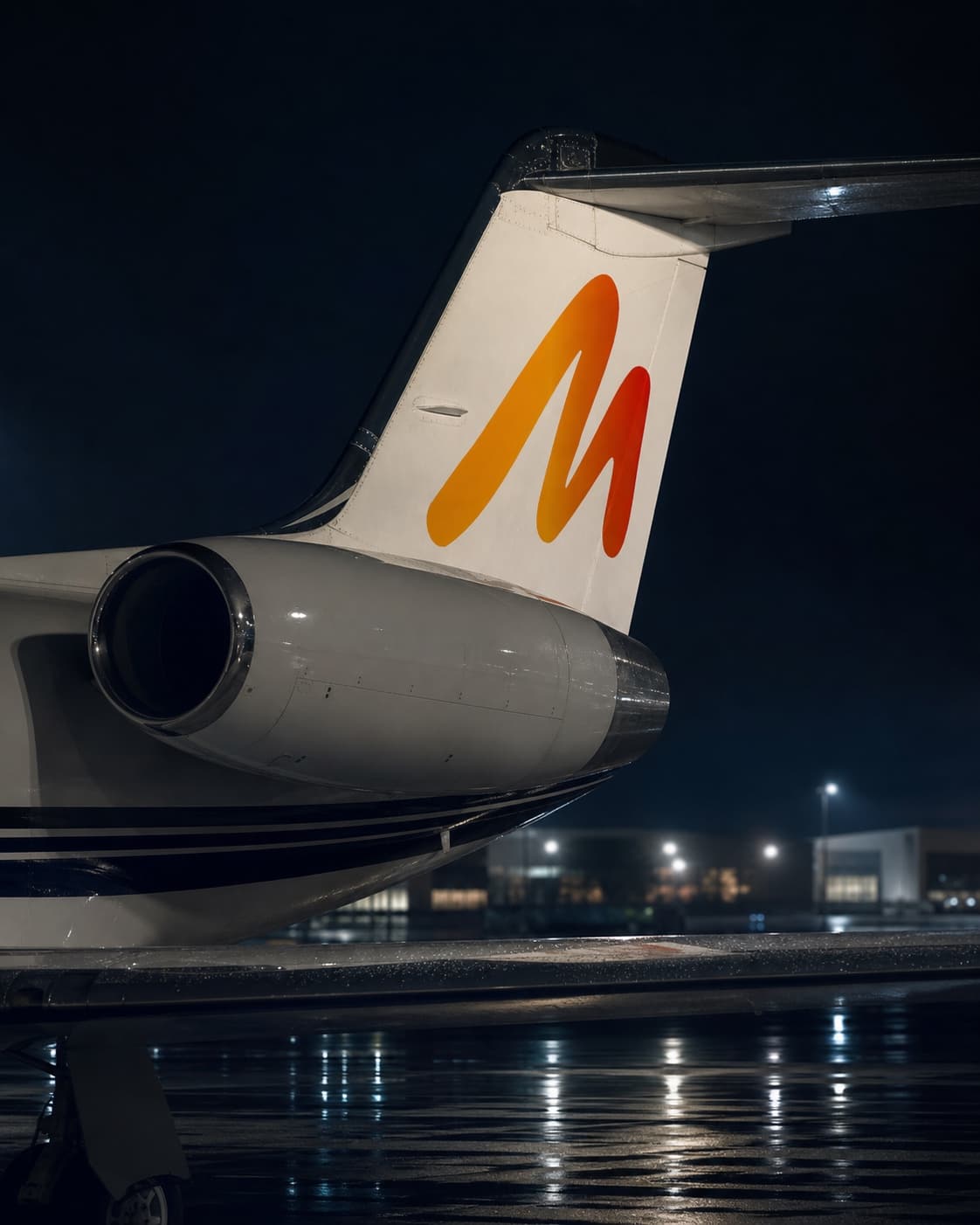 MetaJetz campaign livery on a private aircraft tail at night